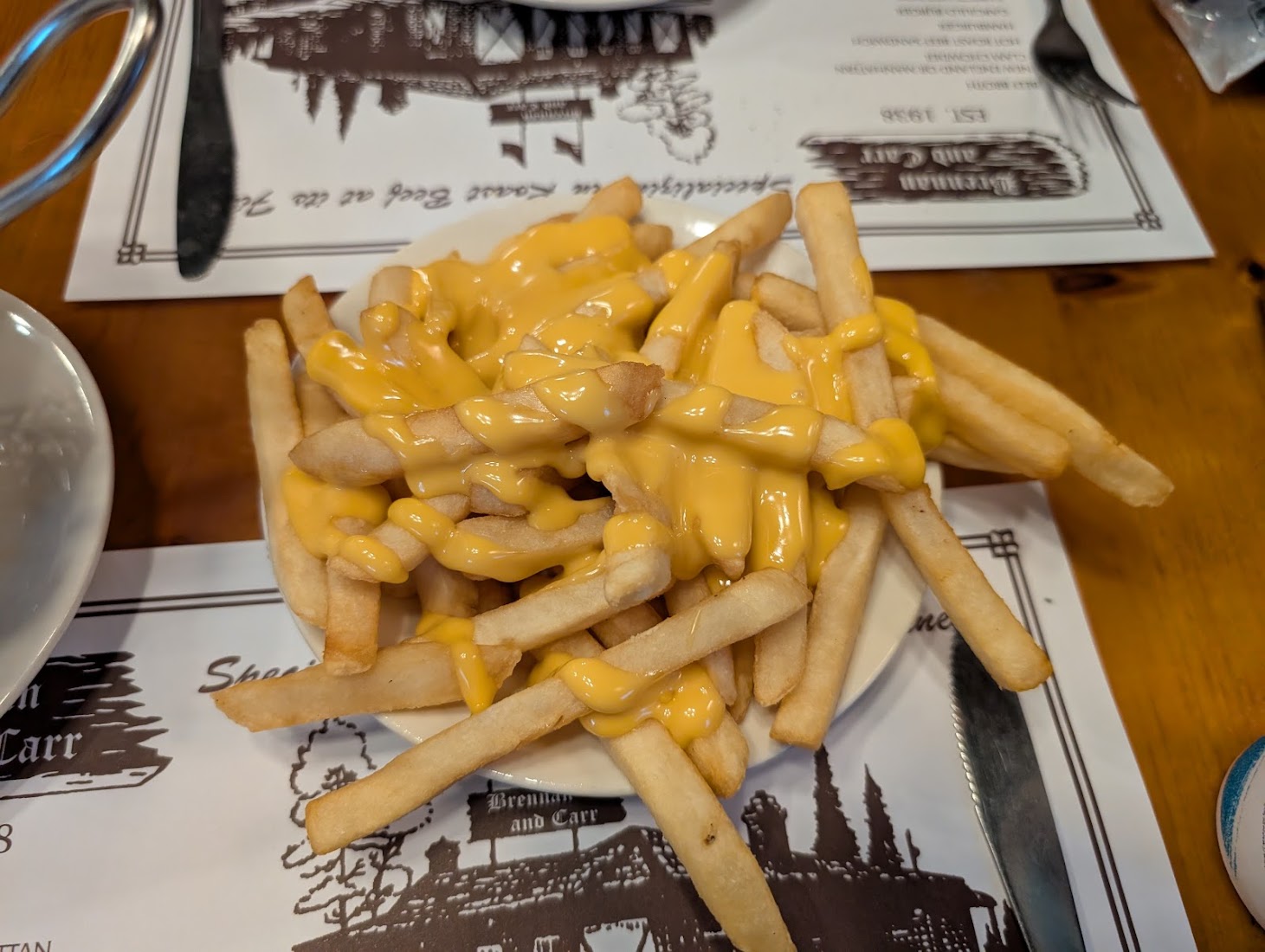 Cheese fries on a Brennan & Carr placemat